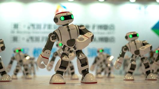Robots dance during a consumer electronics expo at the Beijing China National Convention Center on Jul. 8, 2017 in Beijing, China.