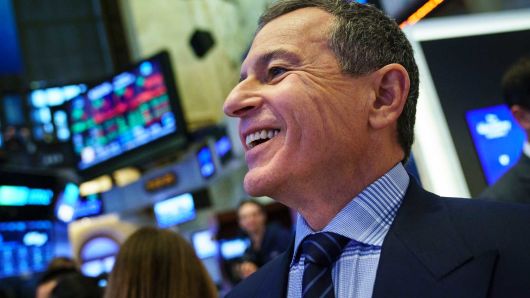Chief executive officer and chairman of The Walt Disney Company Bob Iger walks on the floor of the New York Stock Exchange (NYSE) before ringing the opening bell, November 27, 2017 in New York City.